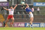 13 April 2025; Cian Reilly of Cavan in action against Darren McCurry of Tyrone during the Ulster GAA Football Senior Championship quarter-final match between Tyrone and Cavan at O'Neills Healy Park in Omagh, Tyrone. Photo by Ramsey Cardy/Sportsfile