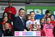 13 April 2025; Uachtarán an Cumann Camógaíochta Brian Molloy presents the cup to Cork captain Meabh Cahalane after the Very National Camogie League Division 1A final match between between Cork and Galway at FBD Semple Stadium in Thurles, Tipperary. Photo by Tom Beary/Sportsfile