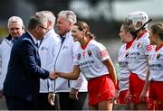 13 April 2025; Uachtarán an Cumann Camógaíochta, Brian Molloy with Cork captain Meabh Cahalane before the Very National Camogie League Division 1A final match between between Cork and Galway at FBD Semple Stadium in Thurles, Tipperary. Photo by Tom Beary/Sportsfile