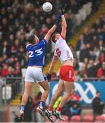 13 April 2025; Brian Kennedy of Tyrone and Cian Madden of Cavan during the Ulster GAA Football Senior Championship quarter-final match between Tyrone and Cavan at O'Neills Healy Park in Omagh, Tyrone. Photo by Ramsey Cardy/Sportsfile