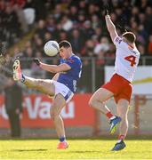 13 April 2025; Ryan Donohoe of Cavan and Niall Devlin of Tyrone during the Ulster GAA Football Senior Championship quarter-final match between Tyrone and Cavan at O'Neills Healy Park in Omagh, Tyrone. Photo by Ramsey Cardy/Sportsfile