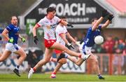 13 April 2025; Aodhan Donaghy of Tyrone in action against Brian O'Connell of Cavan during the Ulster GAA Football Senior Championship quarter-final match between Tyrone and Cavan at O'Neills Healy Park in Omagh, Tyrone. Photo by Ramsey Cardy/Sportsfile