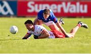 13 April 2025; Brian Kennedy of Tyrone and Killian Clarke of Cavan during the Ulster GAA Football Senior Championship quarter-final match between Tyrone and Cavan at O'Neills Healy Park in Omagh, Tyrone. Photo by Ramsey Cardy/Sportsfile