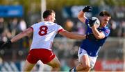 13 April 2025; Gerard Smith of Cavan in action against Brian Kennedy of Tyrone during the Ulster GAA Football Senior Championship quarter-final match between Tyrone and Cavan at O'Neills Healy Park in Omagh, Tyrone. Photo by Ramsey Cardy/Sportsfile