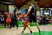 13 April 2025; Kason Harrell of Killester in action against Tobias Christensen of UCC Demons during the Domino's Men's Super League final match between UCC Demons and Killester at the National Basketball Arena in Tallaght, Dublin. Photo by Tyler Miller/Sportsfile