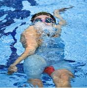 13 April 2025; Lottie Cullen of NCU Swim Belfast competes in the women's 100m backstroke final during day two of the Irish Open Swimming Championships at the National Aquatic Centre on the Sport Ireland Campus in Dublin. Photo by David Fitzgerald/Sportsfile