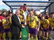 13 April 2025; FAI President Paul Cooke presents the cup to Wexford Football League captain Alan Rhodes during the FAI Oscar Traynor Inter-League Cup final match between Limerick District League and Wexford Football League at Jackman Park in Limerick. Photo by Michael P Ryan/Sportsfile