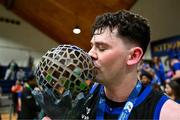 13 April 2025; David Lehane of UCC Demons celebrates with the trophy after the Domino's Men's Super League final match between UCC Demons and Killester at the National Basketball Arena in Tallaght, Dublin. Photo by Tyler Miller/Sportsfile