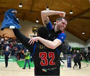 13 April 2025; Elijah Tillman of UCC Demons, 32, and team-mate Kyle Hosford celebrate after the Domino's Men's Super League final match between UCC Demons and Killester at the National Basketball Arena in Tallaght, Dublin. Photo by Tyler Miller/Sportsfile