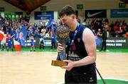 13 April 2025; David Lehane of UCC Demons celebrates with the trophy after the Domino's Men's Super League final match between UCC Demons and Killester at the National Basketball Arena in Tallaght, Dublin. Photo by Tyler Miller/Sportsfile