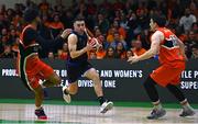13 April 2025; James Hannigan of UCC Demons in action against Isiah Dasher, left, and Ciaran Roe of Killester during the Domino's Men's Super League final match between UCC Demons and Killester at the National Basketball Arena in Tallaght, Dublin. Photo by Tyler Miller/Sportsfile