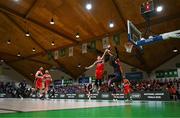 13 April 2025; Patrick Robinson of UCC Demons shoots despite the efforts of Ciaran Roe, left, and Isiah Dasher of Killester during the Domino's Men's Super League final match between UCC Demons and Killester at the National Basketball Arena in Tallaght, Dublin. Photo by Tyler Miller/Sportsfile
