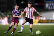 11 April 2025; Shane Ferguson of Derry City in action against Warren Davis of Drogheda United during the SSE Airtricity Men's Premier Division match between Derry City and Drogheda United at The Ryan McBride Brandywell Stadium in Derry. Photo by Stephen McCarthy/Sportsfile