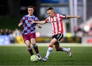 11 April 2025; Shane Ferguson of Derry City in action against Warren Davis of Drogheda United during the SSE Airtricity Men's Premier Division match between Derry City and Drogheda United at The Ryan McBride Brandywell Stadium in Derry. Photo by Stephen McCarthy/Sportsfile