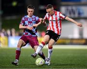 11 April 2025; Shane Ferguson of Derry City in action against Warren Davis of Drogheda United during the SSE Airtricity Men's Premier Division match between Derry City and Drogheda United at The Ryan McBride Brandywell Stadium in Derry. Photo by Stephen McCarthy/Sportsfile
