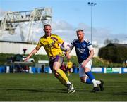 13 April 2025; Eoin Rhodes of Wexford Football League in action against Tom Frawley of Limerick District League during the FAI Oscar Traynor Inter-League Cup final match between Limerick District League and Wexford Football League at Jackman Park in Limerick. Photo by Michael P Ryan/Sportsfile