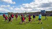 13 April 2025; Dublin players go through a warm up routine before the Leinster GAA Football Senior Championship quarter-final match between Wicklow and Dublin at Echelon Park in Aughrim, Wicklow. Photo by Ray McManus/Sportsfile