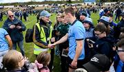 13 April 2025; The Dublin captain Con O'Callaghan is congratulated by wicklow Maor Des Burton, a life long Dublin supporter, after the Leinster GAA Football Senior Championship quarter-final match between Wicklow and Dublin at Echelon Park in Aughrim, Wicklow. Photo by Ray McManus/Sportsfile