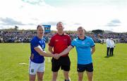 13 April 2025; Match referee Conor Doyle with the two captains, Dean Healy and Con O'Callaghan, before the Leinster GAA Football Senior Championship quarter-final match between Wicklow and Dublin at Echelon Park in Aughrim, Wicklow. Photo by Ray McManus/Sportsfile