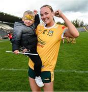 13 April 2025; Ciara Brown of Antrim celebrates with her 2 year old son Curragh after the Lidl Ladies National Football League Division 4 final match between Antrim and Fermanagh at St Tiernach's Park in Clones, Monaghan. Photo by Matt Browne/Sportsfile