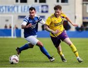 13 April 2025; John Peare of Wexford Football League in action against Joel Coustrain of Limerick District League during the FAI Oscar Traynor Inter-League Cup final match between Limerick District League and Wexford Football League at Jackman Park in Limerick. Photo by Michael P Ryan/Sportsfile