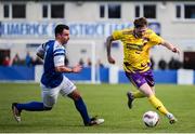 13 April 2025; John Peare of Wexford Football League in action against Joel Coustrain of Limerick District League during the FAI Oscar Traynor Inter-League Cup final match between Limerick District League and Wexford Football League at Jackman Park in Limerick. Photo by Michael P Ryan/Sportsfile