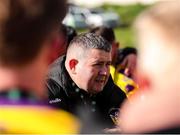 13 April 2025; Wexford Football League manager Willie Peare speaks with his players after their victory in the FAI Oscar Traynor Inter-League Cup final match between Limerick District League and Wexford Football League at Jackman Park in Limerick. Photo by Michael P Ryan/Sportsfile