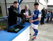 13 April 2025; Limerick District League captain Adam Lipper collects the runners up medals after the FAI Oscar Traynor Inter-League Cup final match between Limerick District League and Wexford Football League at Jackman Park in Limerick. Photo by Michael P Ryan/Sportsfile