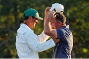 13 April 2025; Rory McIlroy of Northern Ireland and his caddie Harry Diamond celebrate on the 18th green after his playoff victory in the final round of the Masters Tournament at Augusta National Golf Club in Georgia, USA. Photo by Katie Goodale/Imagn Images via Sportsfile