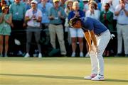 13 April 2025; Rory McIlroy of Northern Ireland reacts on the 18th green after winning his playoff during the final round of the Masters Tournament at Augusta National Golf Club in Georgia, USA. Photo by Peter Casey/Imagn Images via Sportsfile