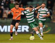 14 April 2025; Aaron Greene of Shamrock Rovers is tackled by Darragh Crowley of Cork City during the SSE Airtricity Men's Premier Division match between Shamrock Rovers and Cork City at Tallaght Stadium in Dublin. Photo by Stephen McCarthy/Sportsfile