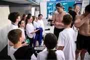14 April 2025; Daniel Wiffen signs autographs after winning the men's 400m freestyle final during day three of the Irish Open Swimming Championships at the National Aquatic Centre on the Sport Ireland Campus in Dublin. Photo by Ramsey Cardy/Sportsfile
