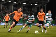 14 April 2025; Charlie Lyons of Cork City in action against Victor Ozhianvuna of Shamrock Rovers during the SSE Airtricity Men's Premier Division match between Shamrock Rovers and Cork City at Tallaght Stadium in Dublin. Photo by Stephen McCarthy/Sportsfile