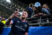 11 April 2025; Joe McCarthy of Leinster takes a selfie with a supporter after the Investec Champions Cup quarter-final match between Leinster and Glasgow Warriors at the Aviva Stadium in Dublin. Photo by Brendan Moran/Sportsfile