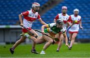 13 April 2025; Mairead Teehan of Offaly in action against Roisin Cassidy of Derry during the Very National Camogie League Division 2A final match between between Derry and Offaly at FBD Semple Stadium in Thurles, Tipperary. Photo by Tom Beary/Sportsfile