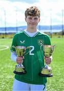 17 April 2025; Leah O’Leary Callender of Republic of Ireland with the Bob Docherty Cup and the John Read Trophy after the Girls U15 SAFIB Bob Docherty Cup match between Northern Ireland and Republic of Ireland at Greenisland FC in Antrim. Photo by Seb Daly/Sportsfile