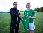 17 April 2025; Halle Harcourt of Republic of Ireland is presented with her jersey by Republic of Ireland head coach Richard Berkeley after the Girls U15 SAFIB Bob Docherty Cup match between Northern Ireland and Republic of Ireland at Greenisland FC in Antrim. Photo by Seb Daly/Sportsfile