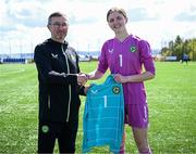 17 April 2025; Republic of Ireland goalkeeper Sarah Doyle is presented with her jersey by Republic of Ireland head coach Richard Berkeley after the Girls U15 SAFIB Bob Docherty Cup match between Northern Ireland and Republic of Ireland at Greenisland FC in Antrim. Photo by Seb Daly/Sportsfile