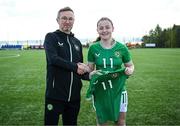 17 April 2025; Abbie Duffy of Republic of Ireland is presented with her jersey by Republic of Ireland head coach Richard Berkeley after the Girls U15 SAFIB Bob Docherty Cup match between Northern Ireland and Republic of Ireland at Greenisland FC in Antrim. Photo by Seb Daly/Sportsfile
