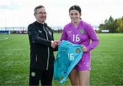 17 April 2025; Republic of Ireland goalkeeper Lucy Doyle Farrington is presented with her jersey by Republic of Ireland head coach Richard Berkeley after the Girls U15 SAFIB Bob Docherty Cup match between Northern Ireland and Republic of Ireland at Greenisland FC in Antrim. Photo by Seb Daly/Sportsfile