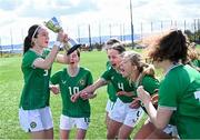 17 April 2025; Republic of Ireland captain Ciara Milton lifts the Bob Docherty Cup alongside teammates after their side's victory in the Girls U15 SAFIB Bob Docherty Cup match between Northern Ireland and Republic of Ireland at Greenisland FC in Antrim. Photo by Seb Daly/Sportsfile