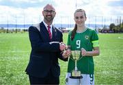 17 April 2025; Republic of Ireland captain Ciara Milton is presented with the Bob Docherty Cup by Schools' Association Football International Board chair Mark Hignett after  the Girls U15 SAFIB Bob Docherty Cup match between Northern Ireland and Republic of Ireland at Greenisland FC in Antrim. Photo by Seb Daly/Sportsfile