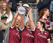 12 April 2025; Galway players from left, Marta Banek, Sophie Healy and Leanne Coen celebrate with the cup after their side's victory in the Lidl Ladies National Football League Division 2 final match between Cork and Galway at Croke Park in Dublin. Photo by Sam Barnes/Sportsfile