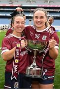 12 April 2025; Galway players Aoife Ní Cheallaigh, left, and Andrea Trill celebrate with the cup after their side's victory in the Lidl Ladies National Football League Division 2 final match between Cork and Galway at Croke Park in Dublin. Photo by Sam Barnes/Sportsfile