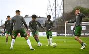 18 April 2025; Cork City players warm-up before the SSE Airtricity Men's Premier Division match between Bohemians and Cork City at Dalymount Park in Dublin. Photo by Shauna Clinton/Sportsfile
