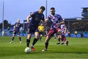 18 April 2025; Sam Bone of Shelbourne in action against Conor Keeley of Drogheda United during the SSE Airtricity Men's Premier Division match between Drogheda United and Shelbourne at Sullivan & Lambe Park in Drogheda, Louth. Photo by Ben McShane/Sportsfile
