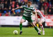 18 April 2025; Rory Gaffney of Shamrock Rovers in action against Sean Hoare of St Patrick's Athletic during the SSE Airtricity Men's Premier Division match between St Patrick's Athletic and Shamrock Rovers at Richmond Park in Dublin. Photo by Stephen McCarthy/Sportsfile