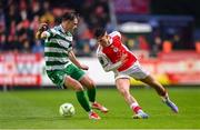 18 April 2025; Mason Melia of St Patrick's Athletic in action against Daniel Cleary of Shamrock Rovers during the SSE Airtricity Men's Premier Division match between St Patrick's Athletic and Shamrock Rovers at Richmond Park in Dublin. Photo by Stephen McCarthy/Sportsfile