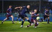 18 April 2025; Mark Coyle of Shelbourne shoots to score his side's first goal despite the efforts of Conor Keeley of Drogheda United during the SSE Airtricity Men's Premier Division match between Drogheda United and Shelbourne at Sullivan & Lambe Park in Drogheda, Louth. Photo by Ben McShane/Sportsfile