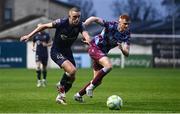 18 April 2025; Evan Caffrey of Shelbourne in action against James Bolger of Drogheda United during the SSE Airtricity Men's Premier Division match between Drogheda United and Shelbourne at Sullivan & Lambe Park in Drogheda, Louth. Photo by Ben McShane/Sportsfile